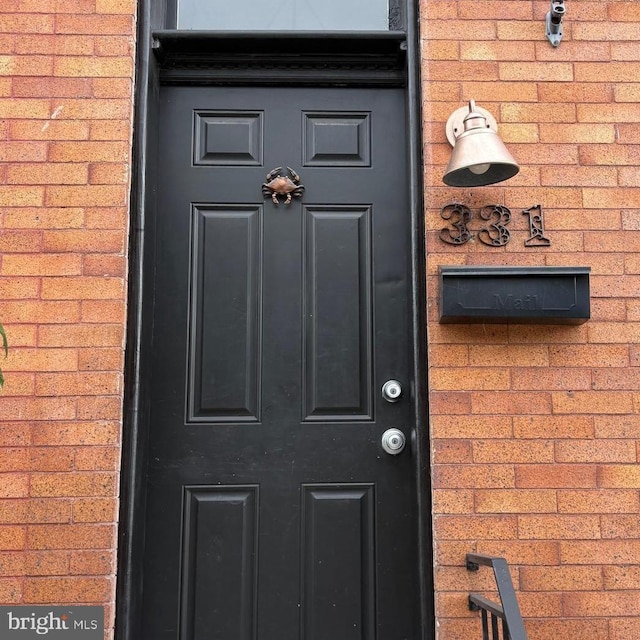 331 S Robinson St, Baltimore, MD 21224 - view of exterior entry featuring brick siding