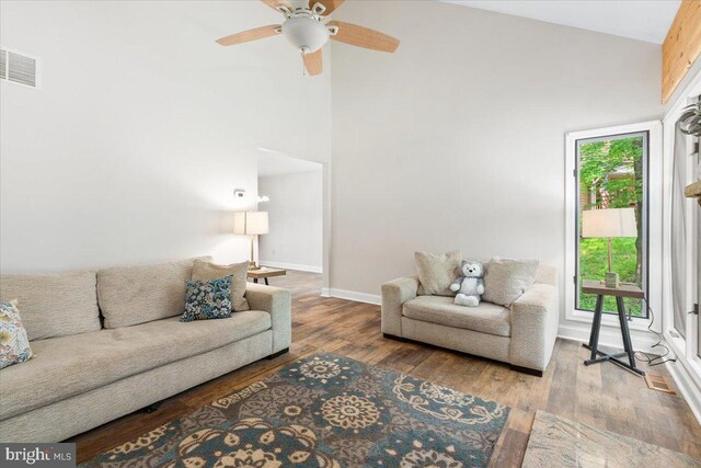 6816 Balmoral Ct, New Market, MD 21774 - living area featuring wood finished floors, high vaulted ceiling, ceiling fan, and baseboards