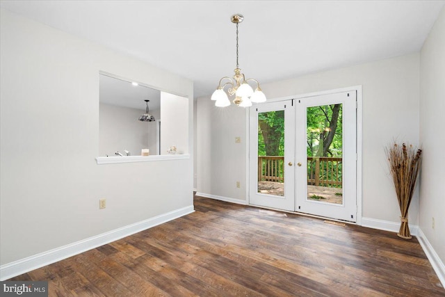 6816 Balmoral Ct, New Market, MD 21774 - unfurnished dining area with a chandelier, wood finished floors, french doors, and baseboards