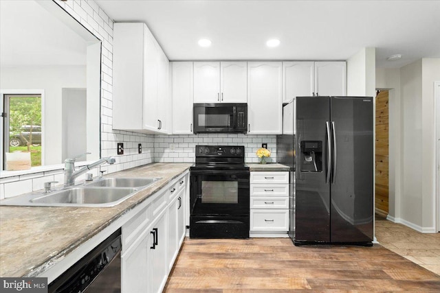 6816 Balmoral Ct, New Market, MD 21774 - kitchen with black appliances, a sink, white cabinetry, backsplash, and recessed lighting