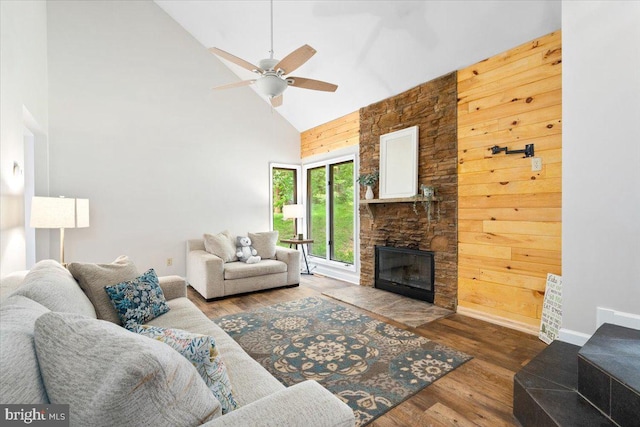 6816 Balmoral Ct, New Market, MD 21774 - living area with high vaulted ceiling, a stone fireplace, a ceiling fan, wood finished floors, and baseboards
