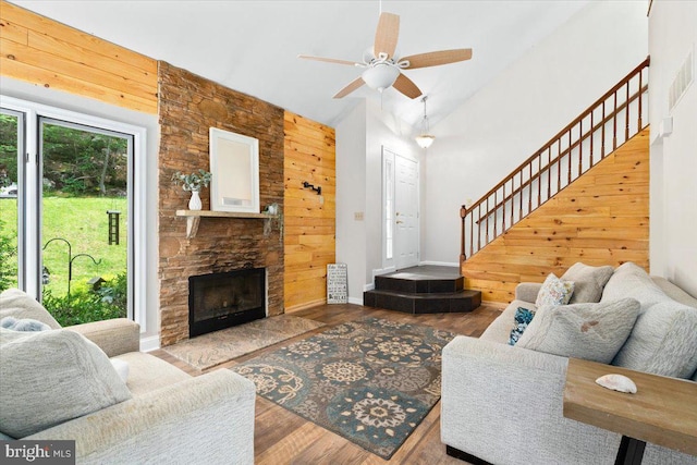 6816 Balmoral Ct, New Market, MD 21774 - living room featuring stairs, wood finished floors, baseboards, ceiling fan, and wood walls