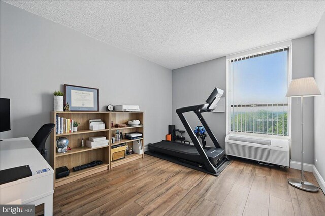666 W Germantown Pike Unit 1706, Plymouth Meeting, PA 19462 - workout area with wood finished floors and a textured ceiling