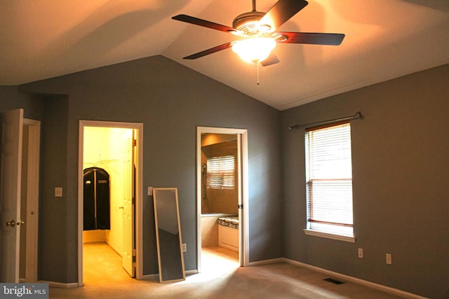 8 Spur Ridge Ct, Newark, DE 19702 - unfurnished bedroom featuring light colored carpet, vaulted ceiling, multiple windows, a spacious closet, and ensuite bathroom