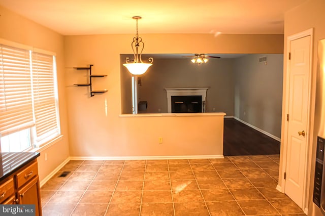 8 Spur Ridge Ct, Newark, DE 19702 - unfurnished living room featuring ceiling fan, a glass covered fireplace, and tile patterned flooring