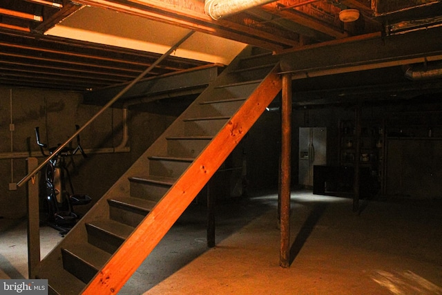 8 Spur Ridge Ct, Newark, DE 19702 - basement with stairs and black fridge with ice dispenser