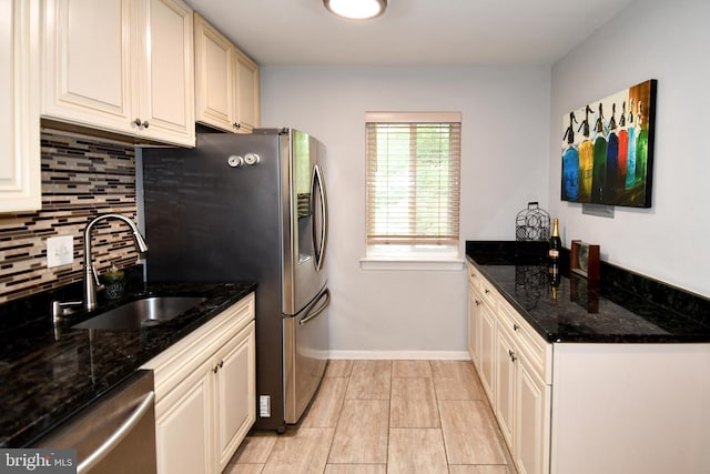11839 Shire Ct Unit 31D, Reston, VA 20191 - kitchen featuring appliances with stainless steel finishes, a sink, tasteful backsplash, baseboards, and dark stone counters
