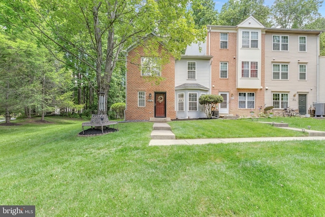 615 Brandon Green Dr, Silver Spring, MD 20904 - view of property featuring brick siding, a front yard, and central AC