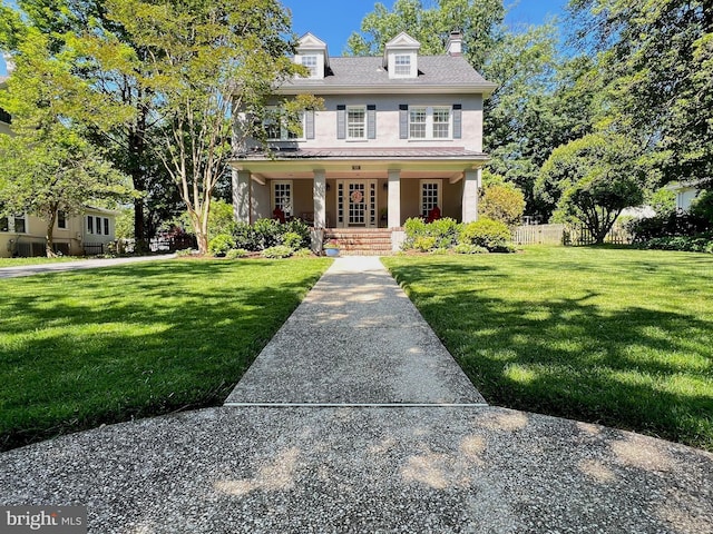 6206 Pinehurst Rd, Baltimore, MD 21212 - view of front facade featuring stucco siding, a porch, and a chimney