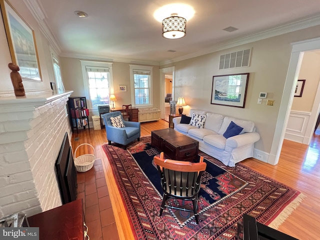 6206 Pinehurst Rd, Baltimore, MD 21212 - living area featuring ornamental molding, wood finished floors, and a brick fireplace