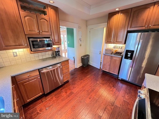 6206 Pinehurst Rd, Baltimore, MD 21212 - kitchen with stainless steel appliances, dark wood-type flooring, decorative backsplash, recessed lighting, and ornamental molding