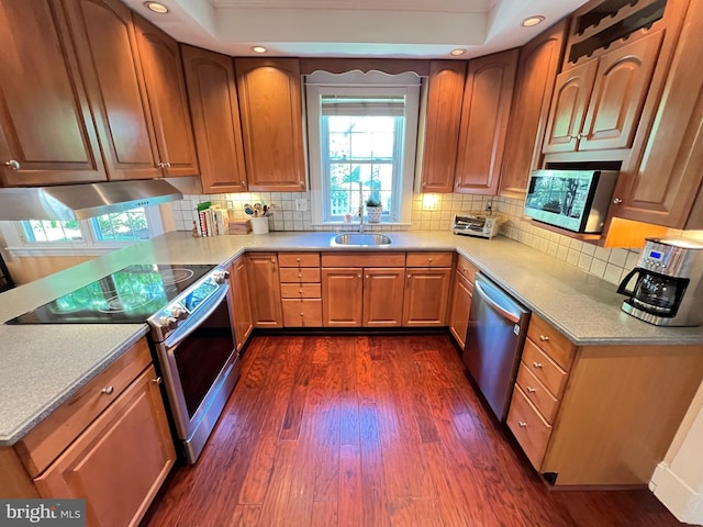 6206 Pinehurst Rd, Baltimore, MD 21212 - kitchen with appliances with stainless steel finishes, dark wood finished floors, a sink, tasteful backsplash, and recessed lighting