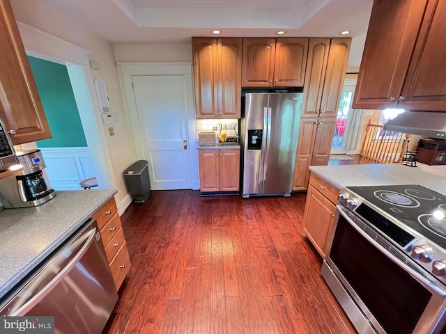 6206 Pinehurst Rd, Baltimore, MD 21212 - kitchen featuring stainless steel appliances, dark wood-style flooring, recessed lighting, brown cabinetry, and tasteful backsplash