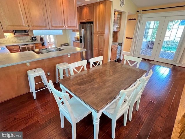 6206 Pinehurst Rd, Baltimore, MD 21212 - dining space with plenty of natural light, dark wood-style floors, and french doors