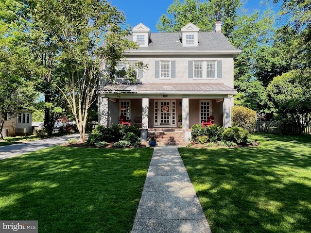 6206 Pinehurst Rd, Baltimore, MD 21212 - view of front of house featuring a porch, stucco siding, metal roof, and a chimney