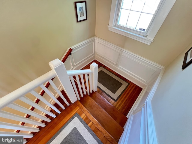 6206 Pinehurst Rd, Baltimore, MD 21212 - staircase featuring a wainscoted wall and a decorative wall