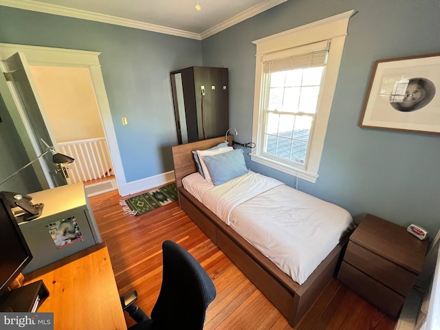 6206 Pinehurst Rd, Baltimore, MD 21212 - bedroom with wood finished floors, ornamental molding, and baseboards