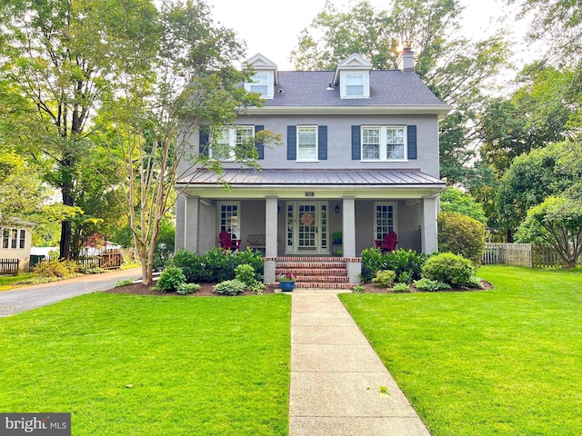 6206 Pinehurst Rd, Baltimore, MD 21212 - view of front facade with stucco siding, a porch, and metal roof