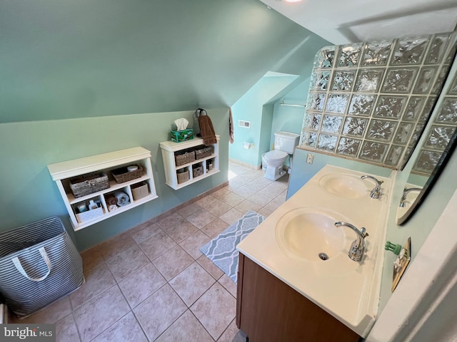 6206 Pinehurst Rd, Baltimore, MD 21212 - bathroom with vaulted ceiling, double vanity, and toilet