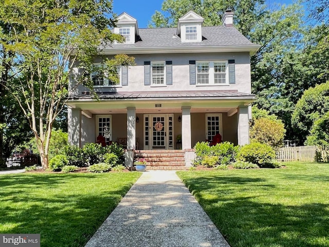 6206 Pinehurst Rd, Baltimore, MD 21212 - view of front facade featuring stucco siding, a standing seam roof, and covered porch
