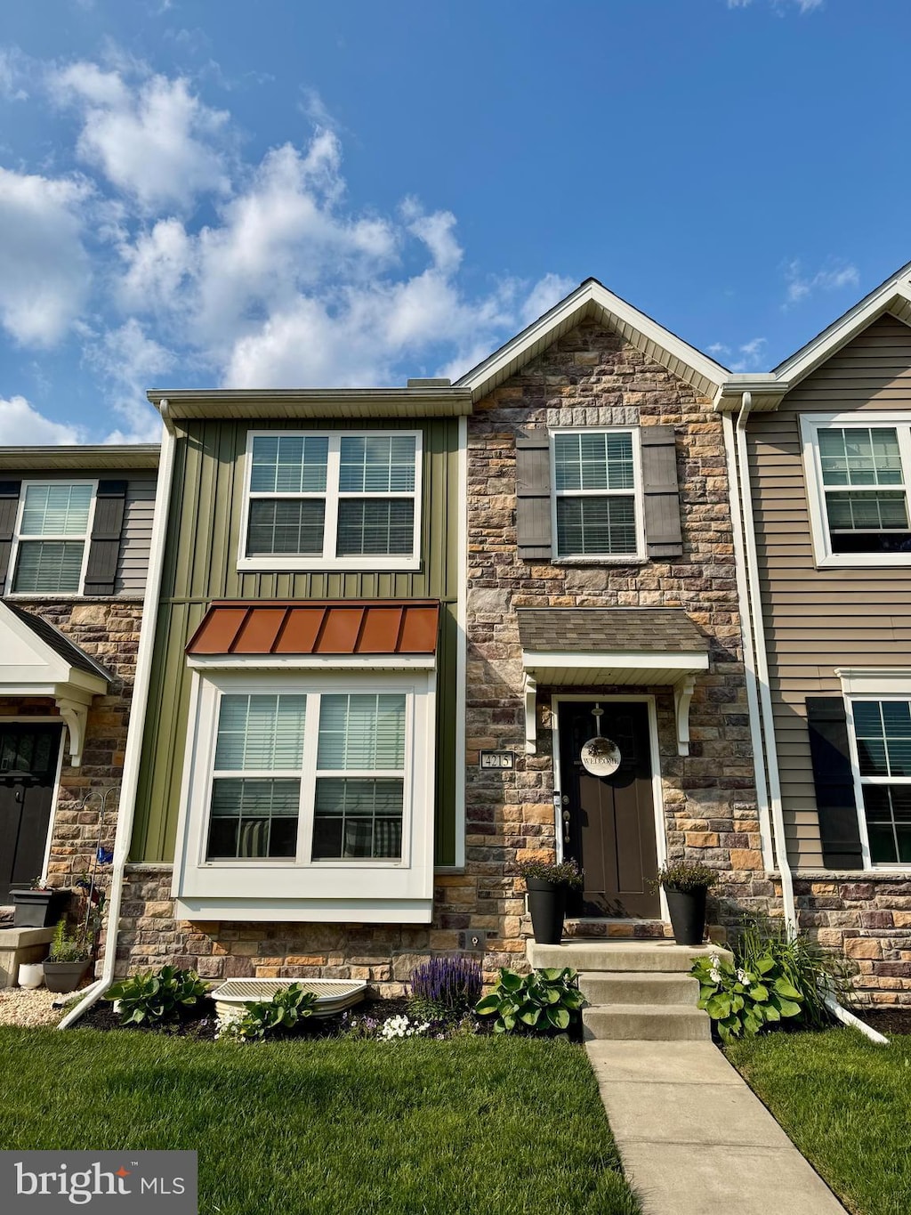 4215 Wild Orchid Ln, Enola, PA 17025 - view of front facade featuring stone siding and board and batten siding