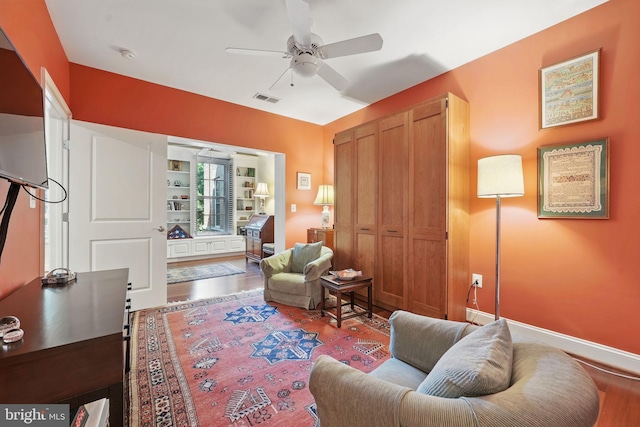 1023 N Royal St Unit 207, Alexandria, VA 22314 - living room with wood finished floors, a ceiling fan, and baseboards