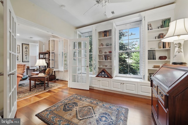 1023 N Royal St Unit 207, Alexandria, VA 22314 - living area with wood finished floors, french doors, and a ceiling fan