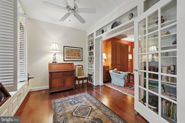 1023 N Royal St Unit 207, Alexandria, VA 22314 - sitting room featuring a ceiling fan, dark wood-style flooring, built in shelves, and baseboards