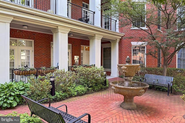 1023 N Royal St Unit 207, Alexandria, VA 22314 - view of patio featuring a balcony and french doors