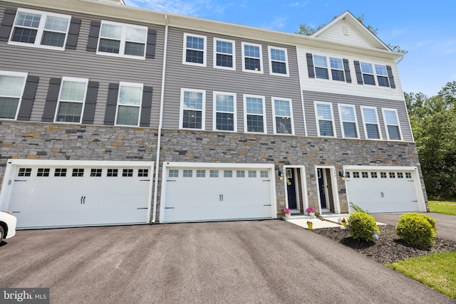 402 Monte Farm Rd, Mount Laurel, NJ 08054 - view of property featuring asphalt driveway, stone siding, and an attached garage