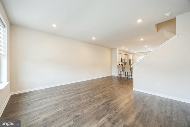 402 Monte Farm Rd, Mount Laurel, NJ 08054 - unfurnished living room with dark wood-type flooring, recessed lighting, baseboards, and stairs