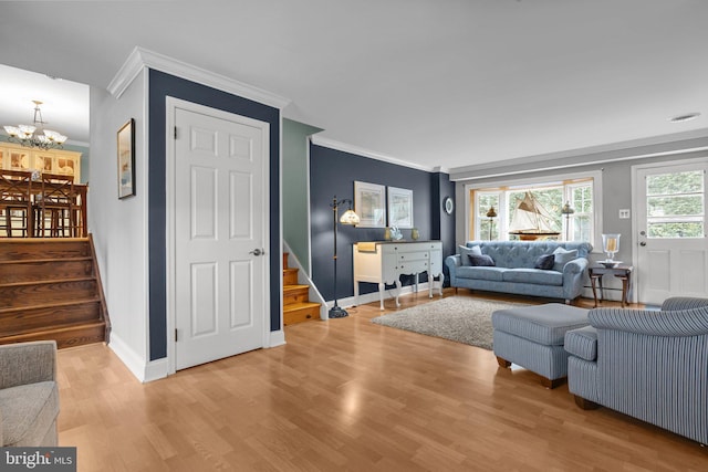 872 Kilby Dr, Yardley, PA 19067 - living room with stairs, ornamental molding, wood finished floors, a chandelier, and a baseboard heating unit