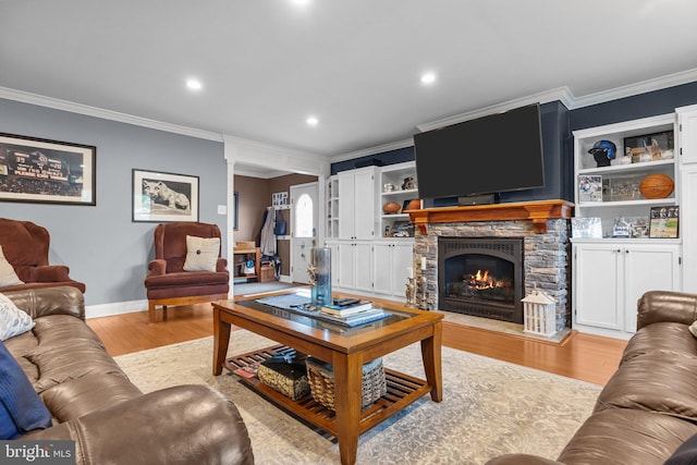 872 Kilby Dr, Yardley, PA 19067 - living room featuring crown molding, light wood-style flooring, a stone fireplace, and recessed lighting