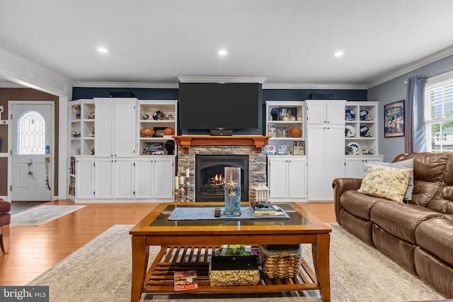 872 Kilby Dr, Yardley, PA 19067 - living room with light wood finished floors, crown molding, a fireplace, and recessed lighting