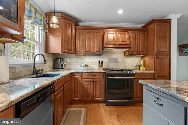 872 Kilby Dr, Yardley, PA 19067 - kitchen featuring gas range oven, stainless steel dishwasher, light wood-type flooring, brown cabinetry, and ornamental molding