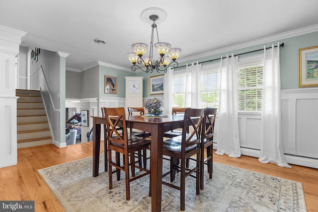 872 Kilby Dr, Yardley, PA 19067 - dining area featuring a chandelier, a decorative wall, ornamental molding, wainscoting, and stairway