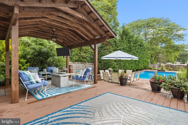 872 Kilby Dr, Yardley, PA 19067 - deck with an outdoor fire pit, a fenced backyard, and a ceiling fan
