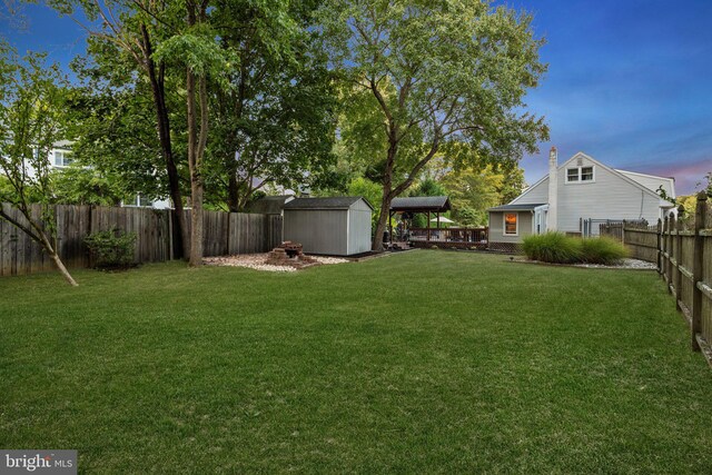872 Kilby Dr, Yardley, PA 19067 - fenced backyard featuring a storage unit and a wooden deck