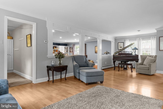 872 Kilby Dr, Yardley, PA 19067 - living room with crown molding, wood finished floors, and ornate columns