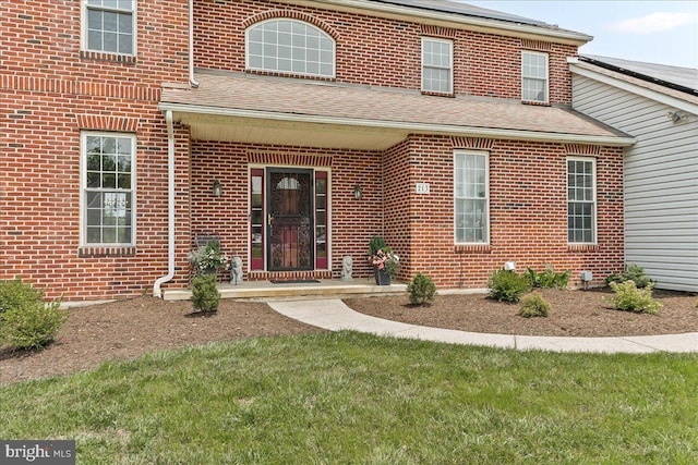 213 Joseph Rd, Oxford, PA 19363 - view of front of home featuring a shingled roof, brick siding, and a front yard
