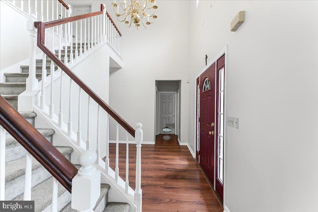 213 Joseph Rd, Oxford, PA 19363 - foyer featuring wood finished floors, stairs, a chandelier, a high ceiling, and baseboards