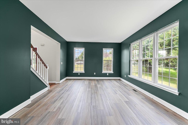 213 Joseph Rd, Oxford, PA 19363 - spare room with wood finished floors, stairway, and baseboards