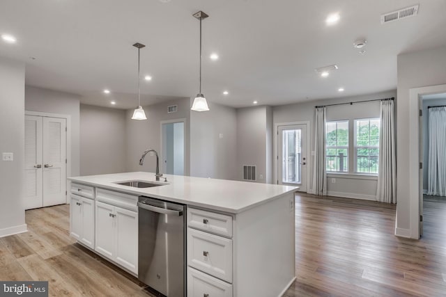 42 Liberty Rd Unit M, Sykesville, MD 21784 - kitchen featuring stainless steel dishwasher, a sink, white cabinetry, light wood-type flooring, and a center island with sink