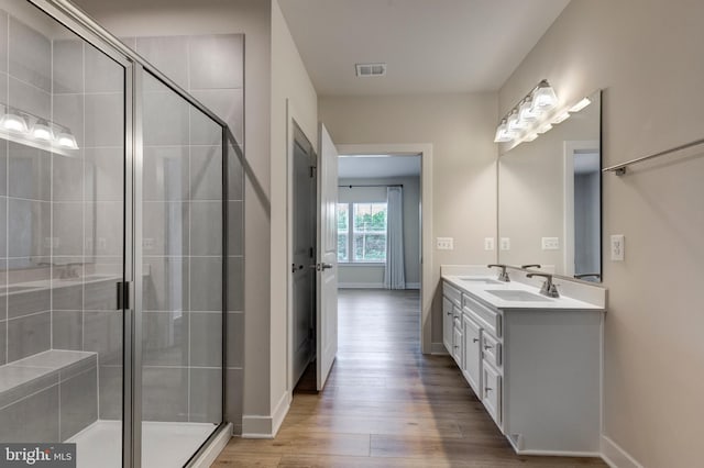 42 Liberty Rd Unit M, Sykesville, MD 21784 - full bathroom with double vanity, wood finished floors, a stall shower, and baseboards