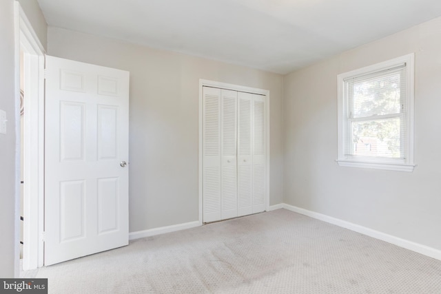 3835 26th Ave, Temple Hills, MD 20748 - unfurnished bedroom featuring carpet flooring, a closet, and baseboards