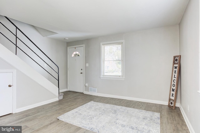 3835 26th Ave, Temple Hills, MD 20748 - entryway with wood finished floors, stairway, and baseboards