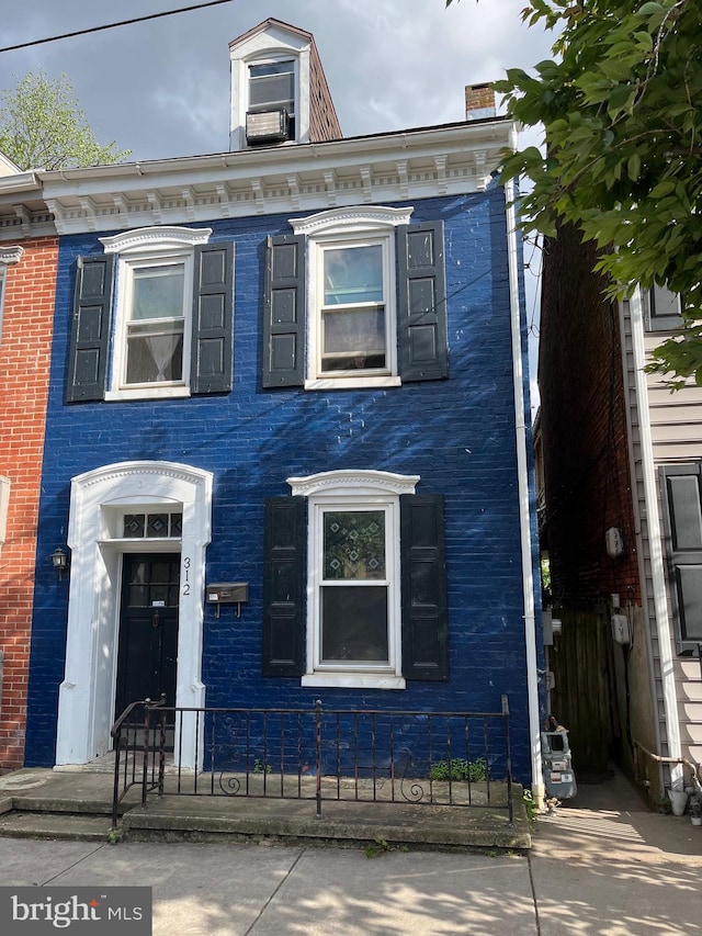 312 W Princess St, York, PA 17401 - view of front of house featuring brick siding and cooling unit