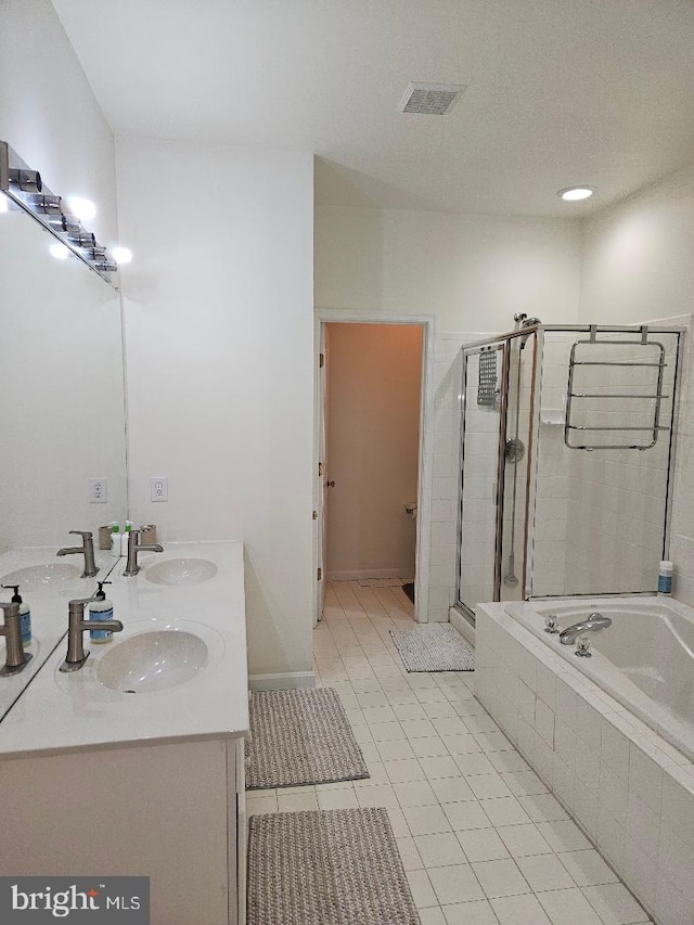 11 Musket Ct Unit 53, West Chester, PA 19380 - bathroom featuring double vanity, a shower stall, a bath, and tile patterned floors
