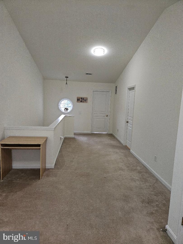 11 Musket Ct Unit 53, West Chester, PA 19380 - hallway featuring carpet floors, an upstairs landing, and vaulted ceiling