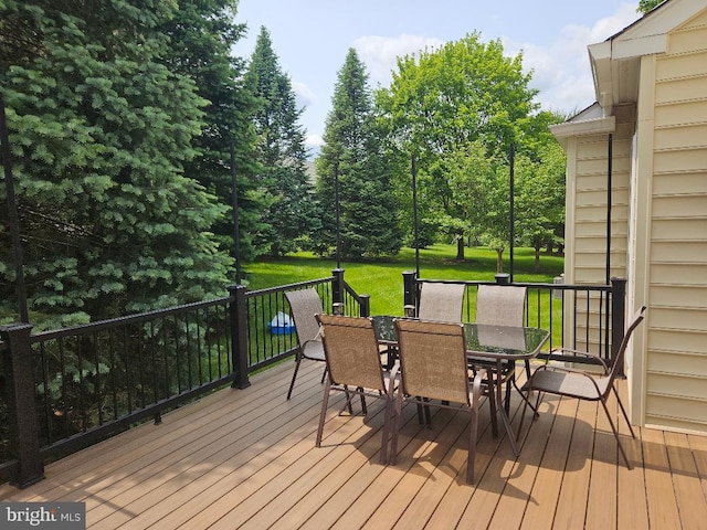 11 Musket Ct Unit 53, West Chester, PA 19380 - wooden deck featuring outdoor dining space and a lawn